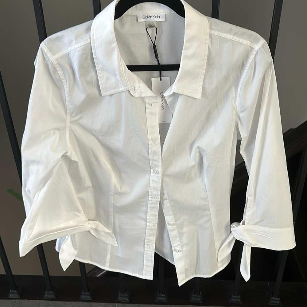 Beautiful crisp white Calvin cotton blouse - never worn and I bought too small.